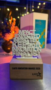 Photo of a trophy comprised of a 3d structure denoting the words "Impact Expected INESC TEC KEPsoft Innovation Finalist."